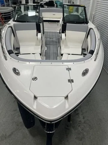 Slide: The Image of 2024 Chaparral 267 SSX boat, sleek white design, spacious seating, modern interior. - 3