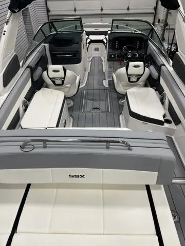 Slide: The Image of 2024 Chaparral 267 SSX boat interior with modern seating and sleek design. - 7