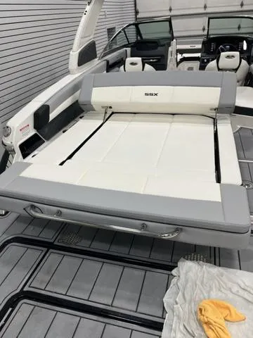 Slide: The Image of 2024 Chaparral 267 SSX boat interior with spacious seating and modern design. - 9
