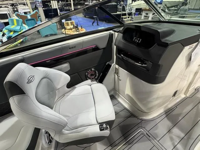 Slide: The Image of 2025 Chaparral 2870 SSX boat interior with modern helm and luxurious seating. - 11