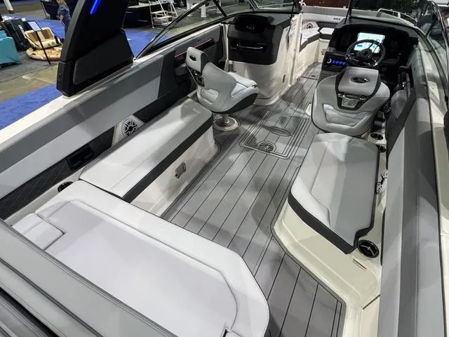Slide: The Image of 2025 Chaparral 2870 SSX boat interior with modern seating and sleek design. - 5