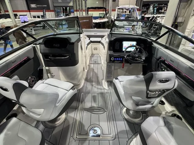 Slide: The Image of 2025 Chaparral 2870 SSX boat interior with modern seating and dashboard controls. - 8