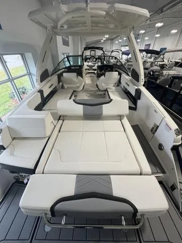 Slide: The Image of 2025 Chaparral 307 SSX boat interior with spacious seating and modern design. - 5