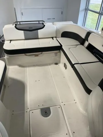 Slide: The Image of 2025 Chaparral 307 SSX boat interior with white and black seating. - 6