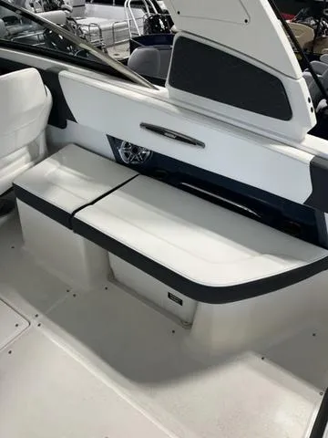 Slide: The Image of 2025 Chaparral 307 SSX boat interior with white seating and sleek design. - 7