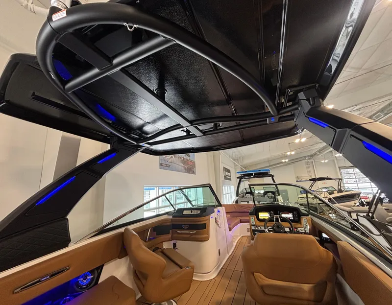 Slide: The Image of 2025 Chaparral 307 SSX boat interior with modern seating and sleek design. - 14