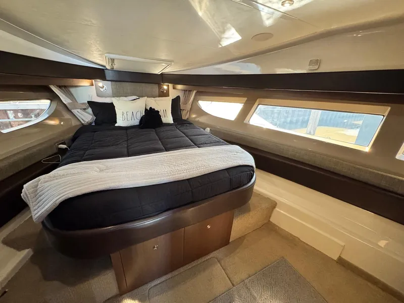 Slide: The Image of Luxurious cabin interior of 2016 Sea Ray 400 Sundancer yacht with cozy bedding. - 25