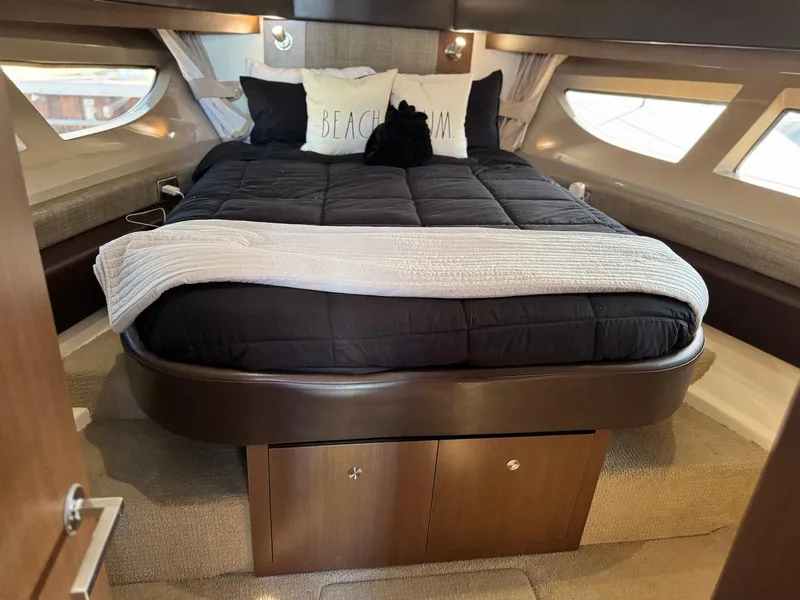 Slide: The Image of Luxurious cabin interior of 2016 Sea Ray 400 Sundancer yacht with cozy bedding. - 26