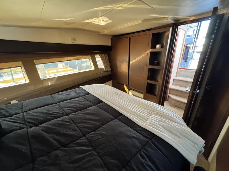 Slide: The Image of Luxurious bedroom interior of 2016 Sea Ray 400 Sundancer yacht with modern design. - 27