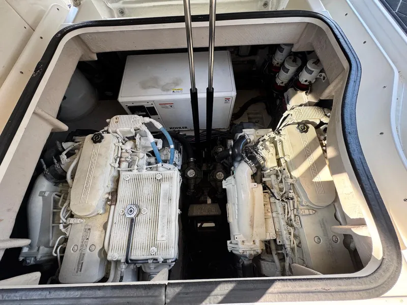 Slide: The Image of Engine compartment of a 2016 Sea Ray 400 Sundancer yacht, showcasing dual engines and generator. - 41