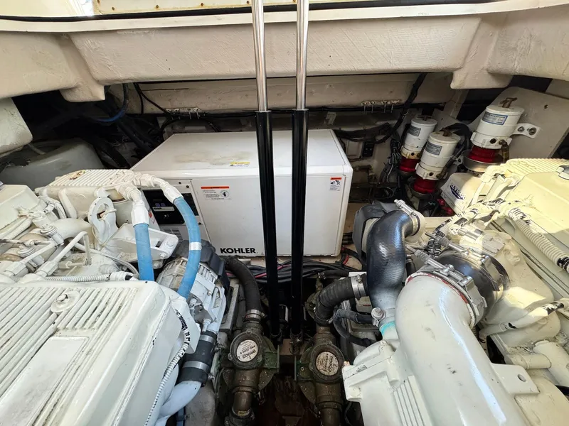 Slide: The Image of Engine room of 2016 Sea Ray 400 Sundancer with Kohler generator and dual engines. - 42