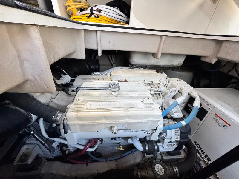 Slide: The Image of Engine room of 2016 Sea Ray 400 Sundancer with Kohler generator and marine equipment. - 44