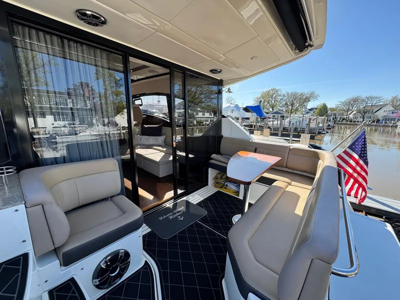 Slide: The Image of 2016 Sea Ray 400 Sundancer yacht with spacious seating and elegant interior design. - 5