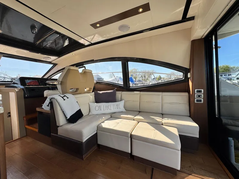Slide: The Image of Luxurious interior of 2016 Sea Ray 400 Sundancer yacht with plush seating and modern design. - 9