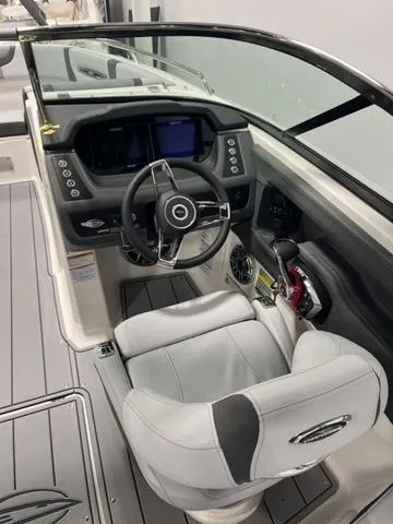 Slide: The Image of 2025 Chaparral 247 SSX boat cockpit with modern steering and controls. - 6