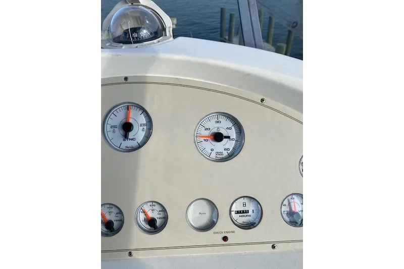 Slide: The Image of Dashboard of 1996 Cruisers Yachts 3650 Motoryacht with gauges and compass. - 10