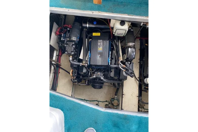 Slide: The Image of 1996 Cruisers Yachts 3650 Motoryacht engine compartment with visible components and wiring. - 18