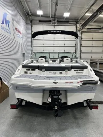 Slide: The Image of 2024 Chaparral 21 SSi boat in showroom, rear view with trailer. - 4