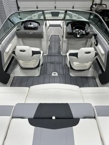 Slide: The Image of 2024 Chaparral 21 SSi boat interior with modern seating and sleek dashboard design. - 5