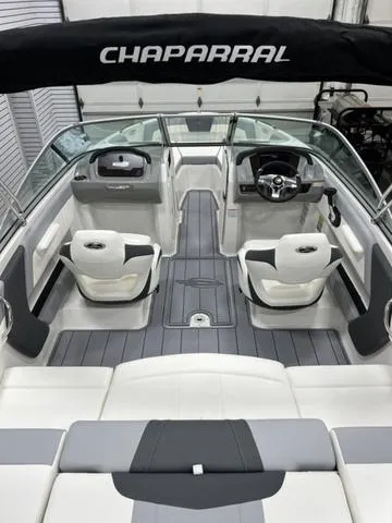 Slide: The Image of 2024 Chaparral 21 SSi boat interior with sleek seating and modern dashboard. - 6