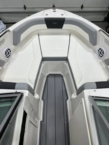 Slide: The Image of 2024 Chaparral 21 SSi boat interior with sleek seating and modern design. - 7
