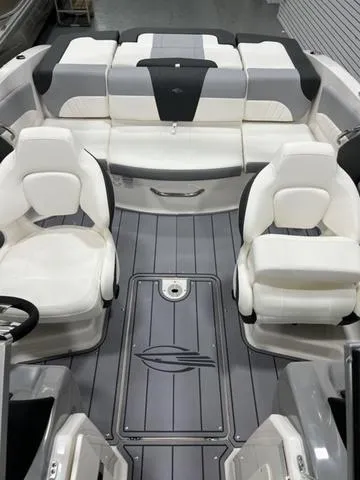 Slide: The Image of 2024 Chaparral 21 SSi boat interior with white and gray seating, modern design. - 8