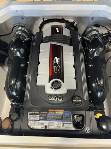 Slide: The Image of 2025 Chaparral 23 Surf boat engine, featuring a powerful Mercury 300 horsepower motor. - 12