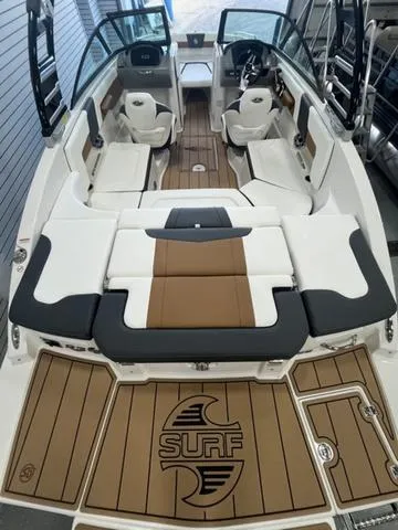 Slide: The Image of 2025 Chaparral 23 Surf boat interior with stylish seating and modern design. - 5