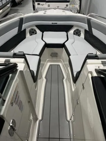 Slide: The Image of 2025 Chaparral 26 Surf boat interior with sleek seating and modern design. - 10