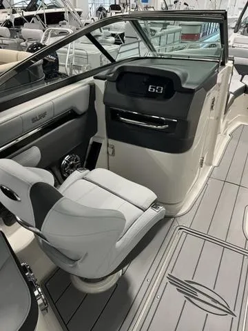 Slide: The Image of 2025 Chaparral 26 Surf boat interior with modern dashboard and seating. - 5