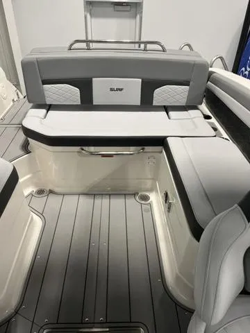 Slide: The Image of 2025 Chaparral 26 Surf boat interior with gray seating and modern design. - 6