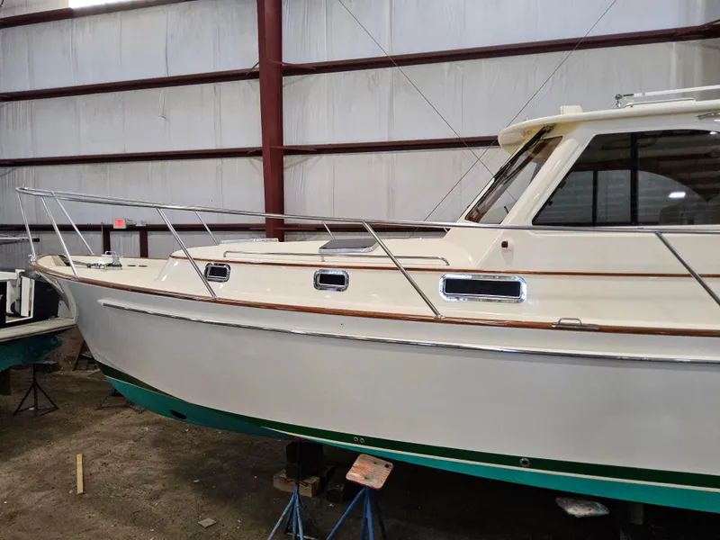 Slide: The Image of 2003 Legacy 40 Hardtop Express boat in indoor storage facility. - 4