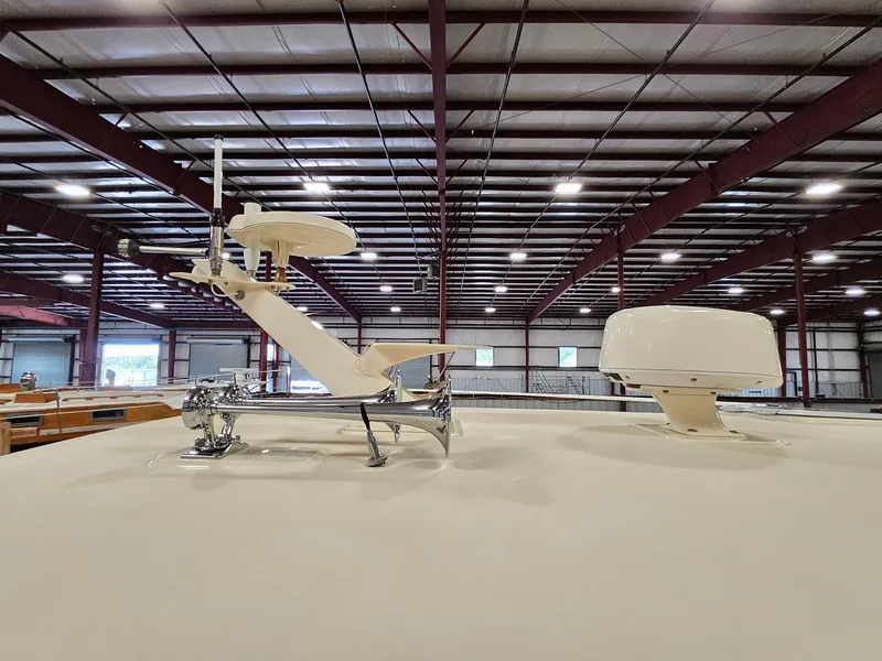 Slide: The Image of Rooftop equipment on 2003 Legacy 40 Hardtop Express boat in a warehouse setting. - 7