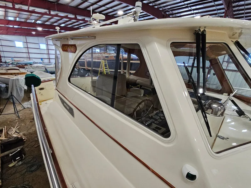 Slide: The Image of 2003 Legacy 40 Hardtop Express yacht in indoor storage facility. - 8