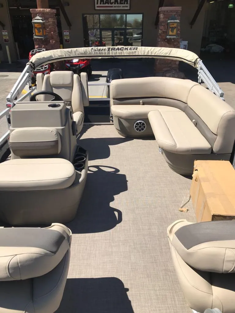 Slide: The Image of 2025 Sun Tracker Bass Buggy 16 XL Select pontoon boat with spacious seating and modern design. - 8