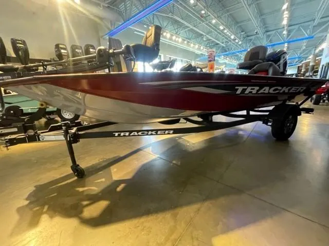 Slide: The Image of 2025 Tracker Pro Team 175 boat displayed in a showroom, side view. - 3