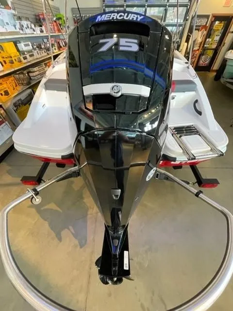 Slide: The Image of 2025 Tahoe T16 boat with Mercury 75 engine displayed in showroom. - 2