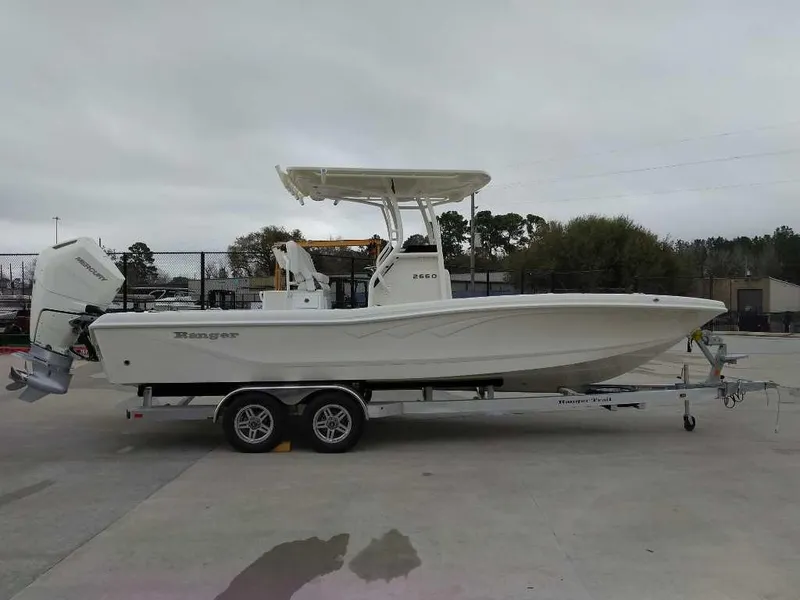 The Image of 2025 Ranger 2660 Bay boat on trailer, side view, outdoors. - 0