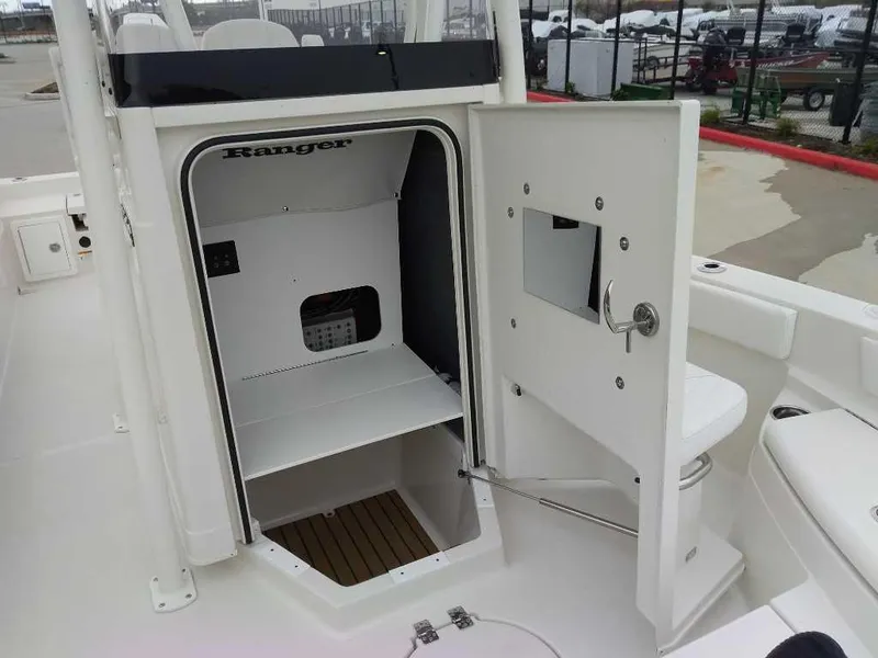 Slide: The Image of 2025 Ranger 2660 Bay boat interior with open storage compartment. - 10