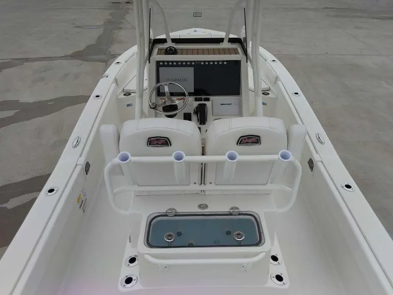 Slide: The Image of 2025 Ranger 2660 Bay boat interior with steering console and rod holders. - 5
