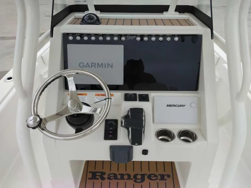 Slide: The Image of 2025 Ranger 2660 Bay boat console with Garmin and Mercury controls. - 6