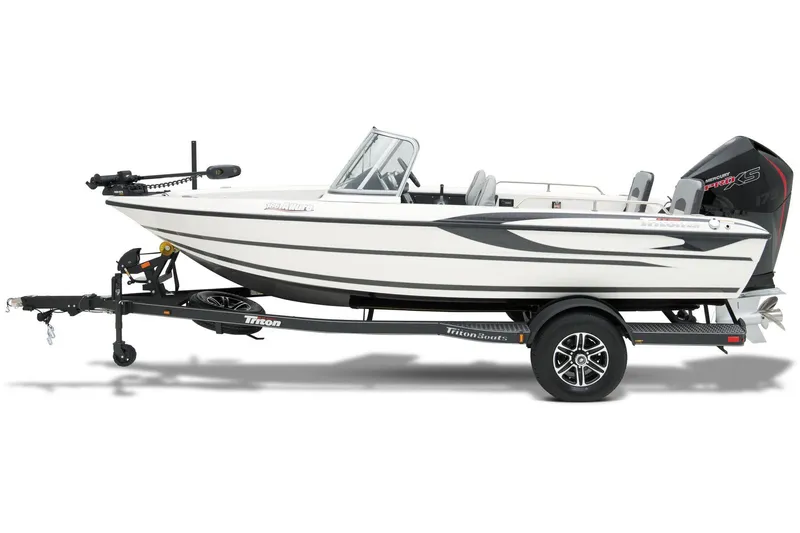 Slide: The Image of 2024 Triton 186 Allure boat on trailer under shelter, side view. - 10