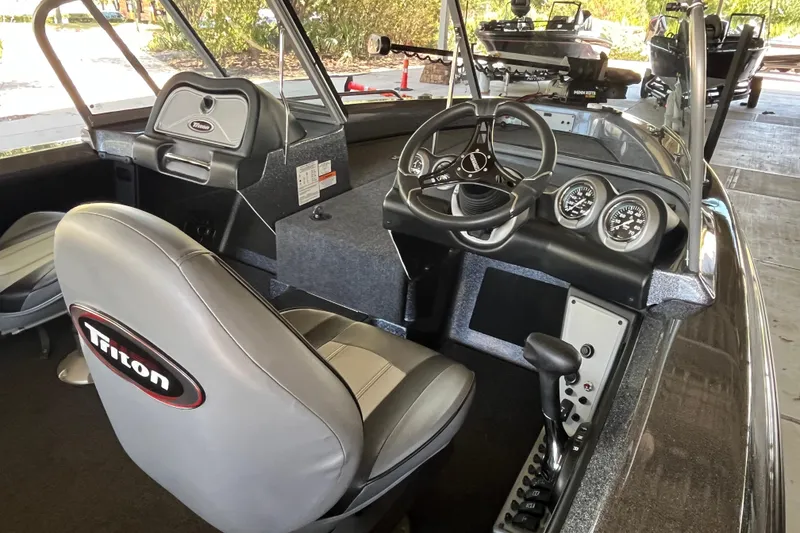 Slide: The Image of 2024 Triton 186 Allure boat displayed at Outdoor World. - 3