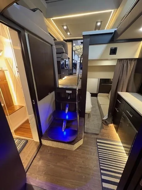 Slide: The Image of Interior of a 2018 Regal 42 Grande Coupe yacht, featuring modern lighting and sleek design. - 11
