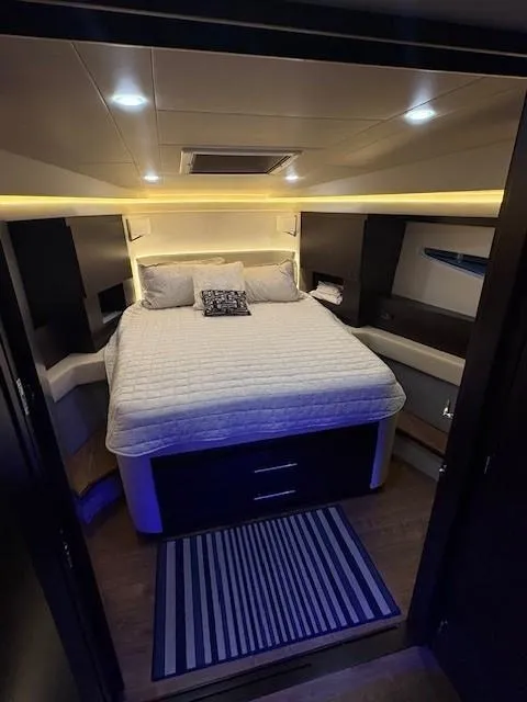 Slide: The Image of Luxurious bedroom interior of 2018 Regal 42 Grande Coupe yacht with modern lighting. - 12