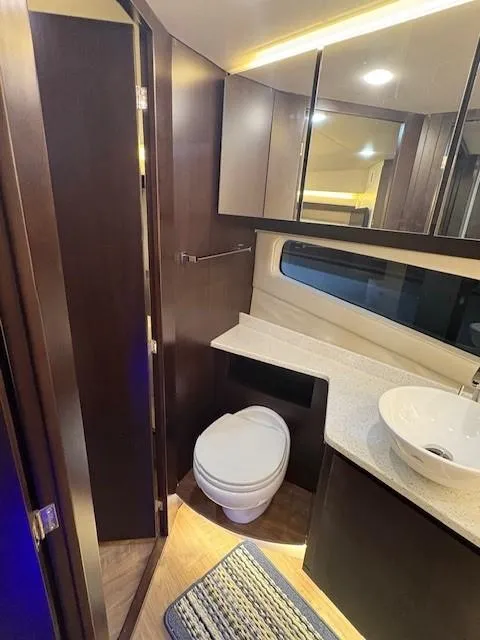 Slide: The Image of Luxurious bathroom in 2018 Regal 42 Grande Coupe yacht with modern fixtures and elegant design. - 14