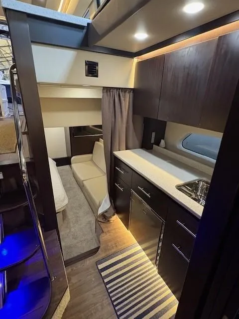 Slide: The Image of Interior of 2018 Regal 42 Grande Coupe yacht with modern kitchen and seating area. - 16