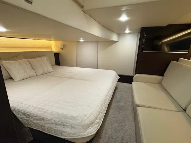 Slide: The Image of Luxurious interior of 2018 Regal 42 Grande Coupe with bed, sofa, and TV. - 17