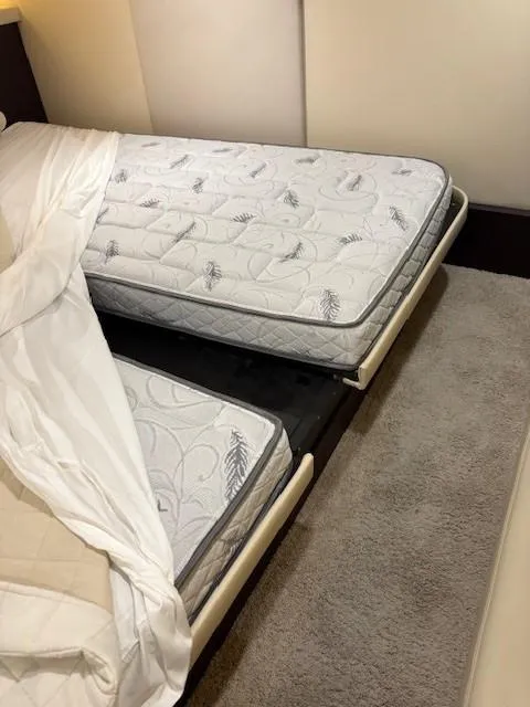 Slide: The Image of Interior of 2018 Regal 42 Grande Coupe with twin beds and plush carpet. - 19