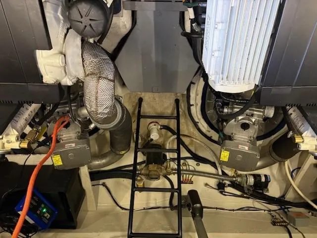 Slide: The Image of Engine room of 2018 Regal 42 Grande Coupe with visible components and wiring. - 25
